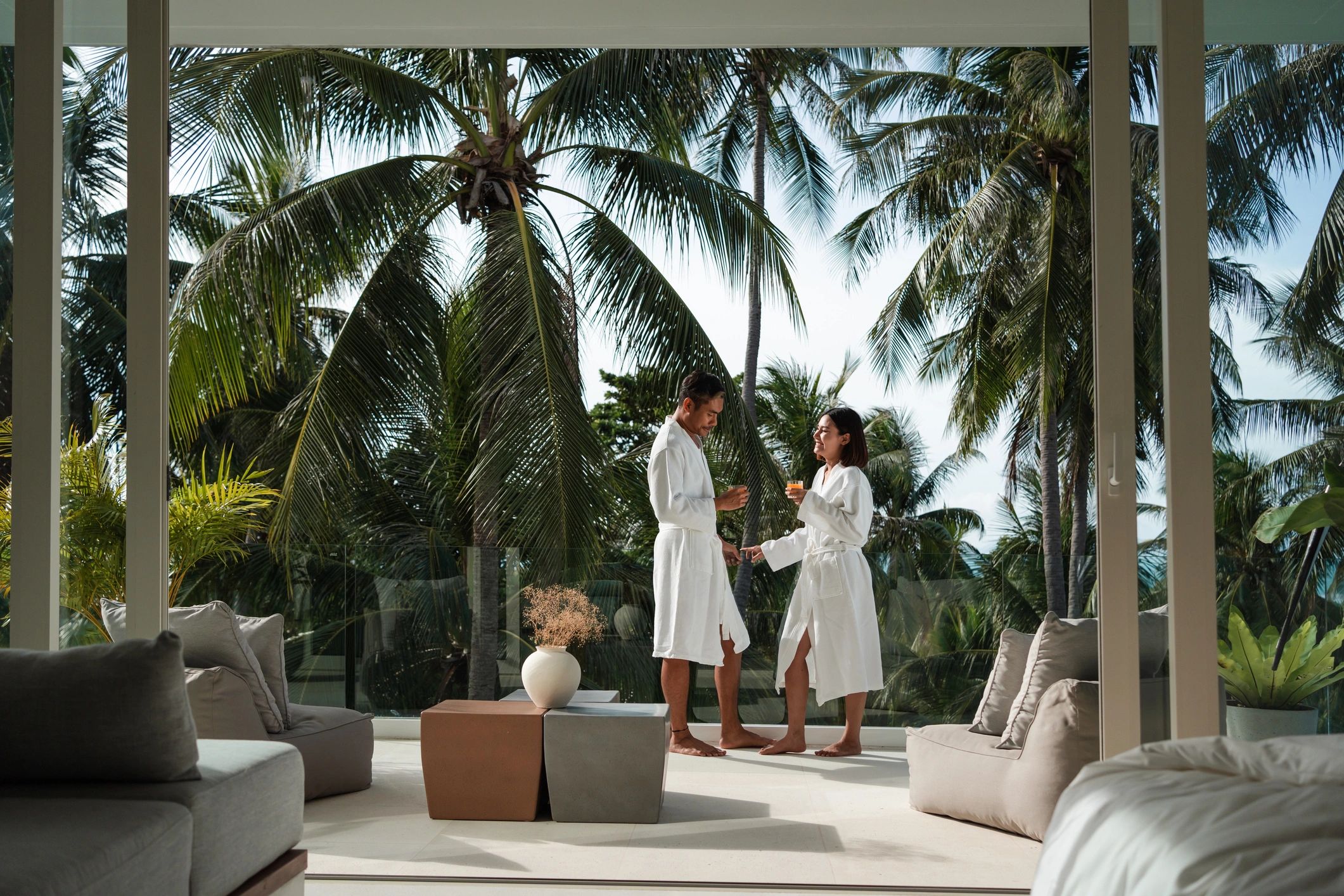 Couple relaxing on a balcony during a luxury getaway